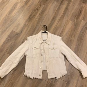 Ripped white denim jacket